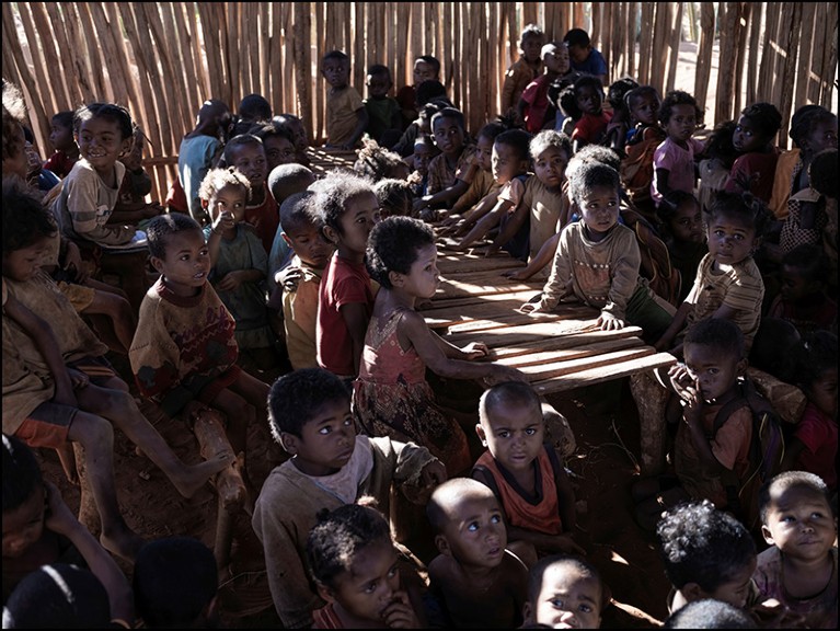 A group of Malagasy children facing a food crisis from drought wait for food distribution in Madagascar on September 29, 2021.