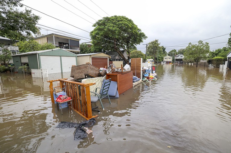Rubbish and damaged furniture piled up on a flooded road on March 03, 2022 in Brisbane, Australia.