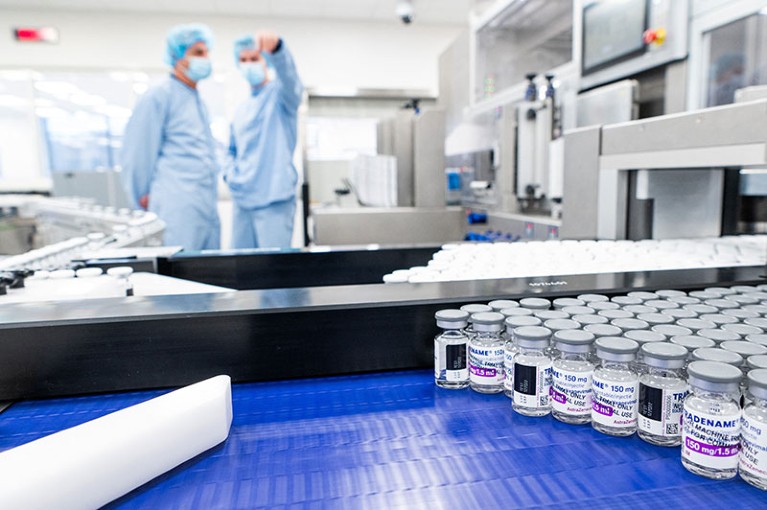 Employees work at the assembly line of the manufacturing facility of pharmaceutical company AstraZeneca in Sweden.