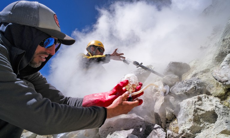 Marteen de Moor and his colleague place collecting tubes and bottles in the most active area of the Olca crater.