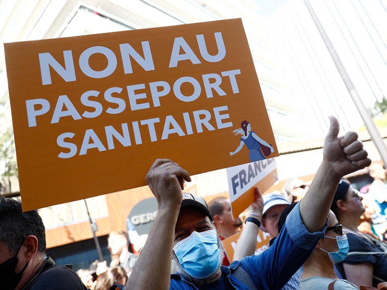 A demonstrator holds up a placard which reads as "No to Health Pass" during a protest called by French nationalist party.