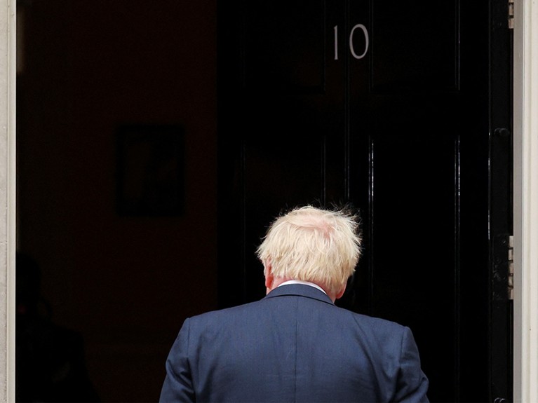 British Prime Minister Boris Johnson leaves after making a resignation statement at Downing Street in London, July 7, 2022.