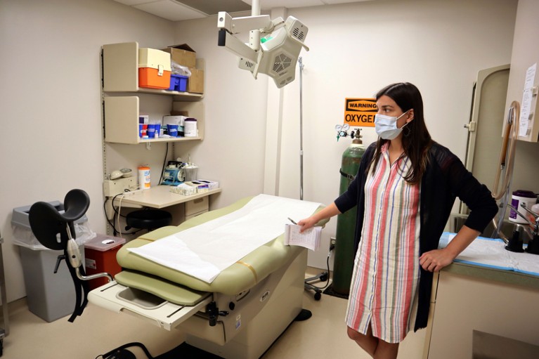 A nurse stands in an examination room that was used to perform abortions.