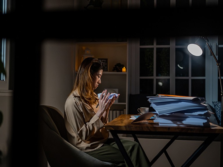 Asian businesswoman online working at the night. Busy and exhausted of work overtime at home.