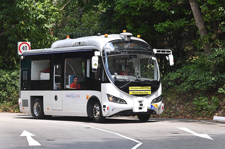 An autonomous shuttle bus on a road in Singapore, during a trial run.