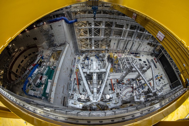 Wide angle view down into a meeting room at ITER where a vacuum vessel sector is being built