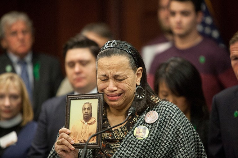 A mother cries during a press conference, as she describes how her only son was shot to death in Chicago, Illinois, U.S.