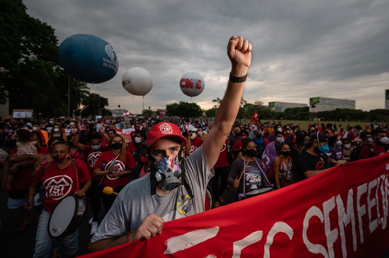 A protester wearing a gas mask during a protest against Brazilain President Jair Bolsonaro in Brasilia.