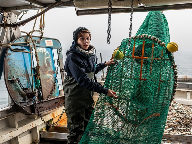 Laura Aiudi on a trawler. working as field researcher at the Cetacea Foundation in Riccione, Italy.