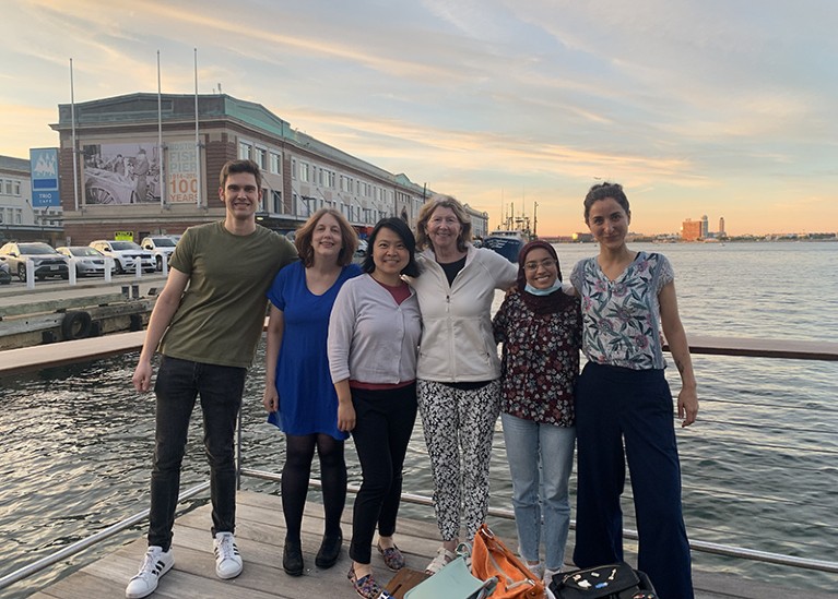 Joyce Bischoff photographed with five lab members in the Seaport area in Boston.