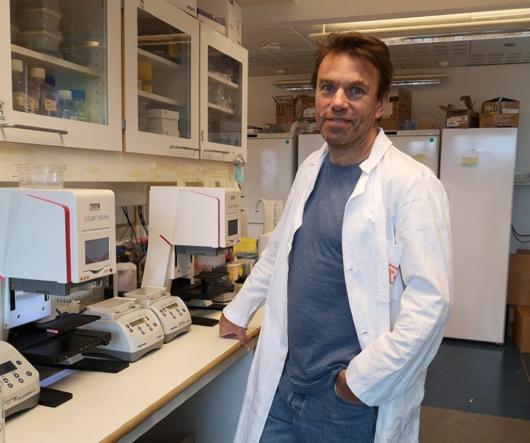 Fridtjof Lund-Johansen standing in a laboratory