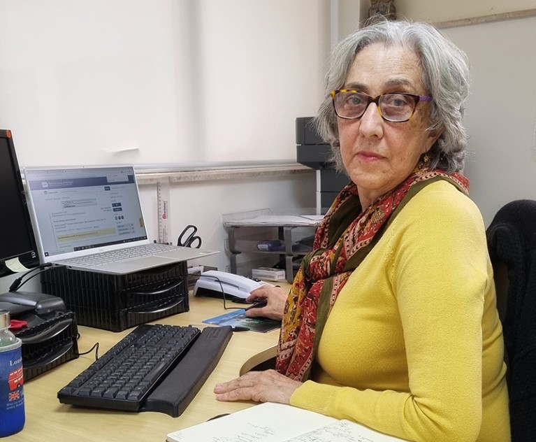 Maria Paula Curado sitting at a desk