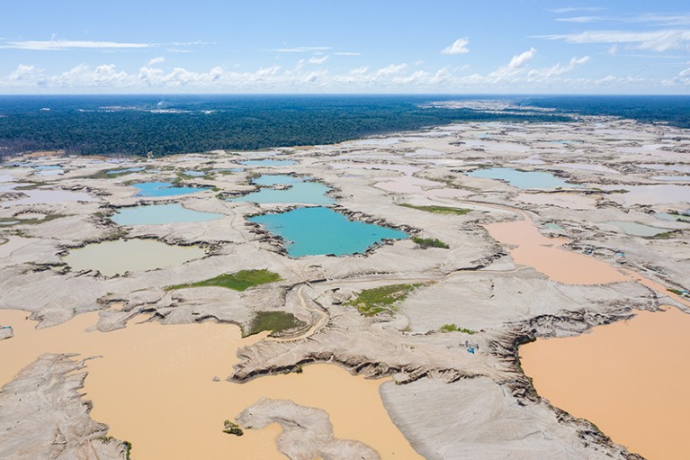 Aerial view of the remains of the illegal La Pampa gold mine, in the Peruvian Amazon rain forest