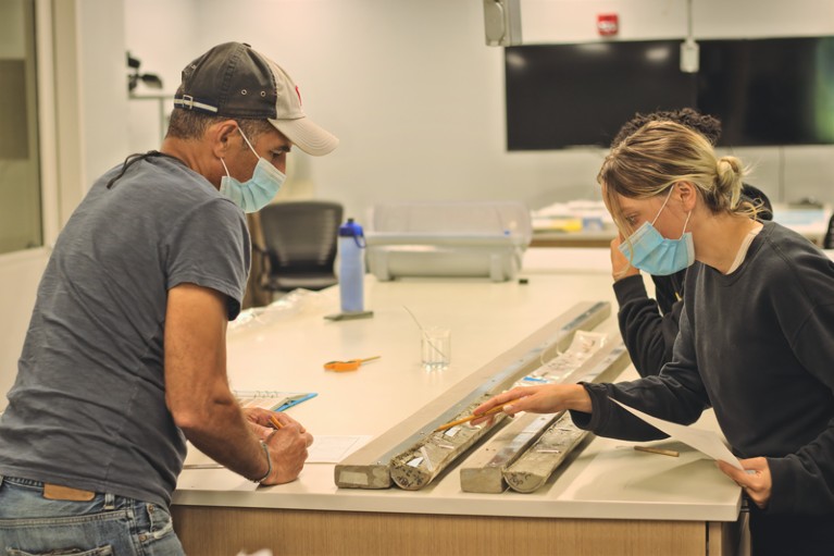Anna Silvis and Matthew Danielson studying sediment cores the Oregon State University Marine and Geology Repository