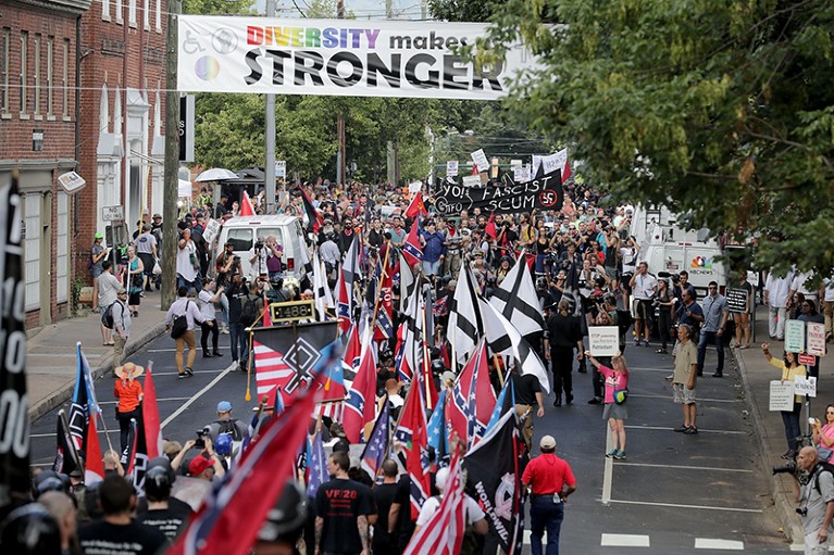 Hundreds of white nationalists march in the street towards counter-protesters in Charlottesville, Virginia, in 2017.