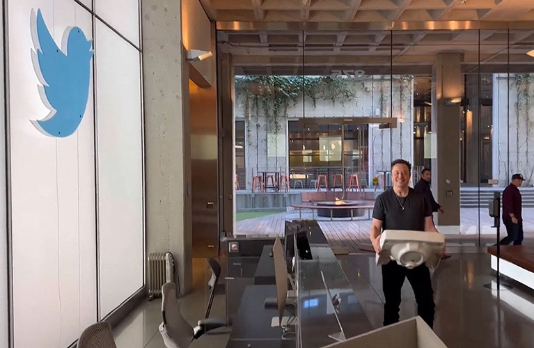 Image from his Twitter account showing Elon Musk carrying a sink as he enters the Twitter headquarters in San Francisco.