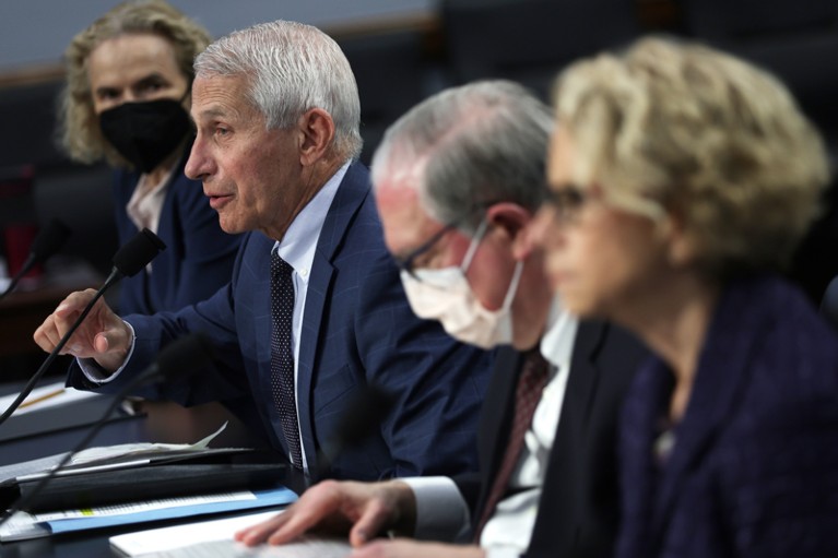 Anthony Fauci speaks into a microphone during a hearing