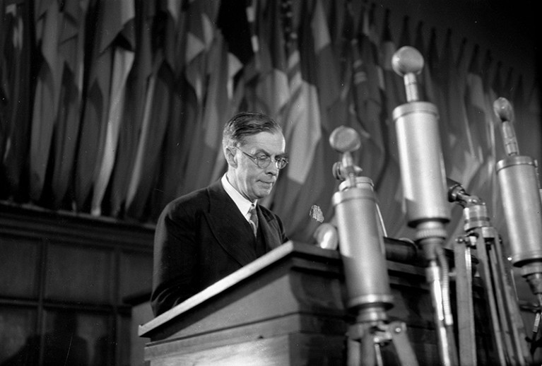 A member of a British delegation, biologist, UNESCO secretary general prof. Julian Huxley speaking at a podium in 1948.