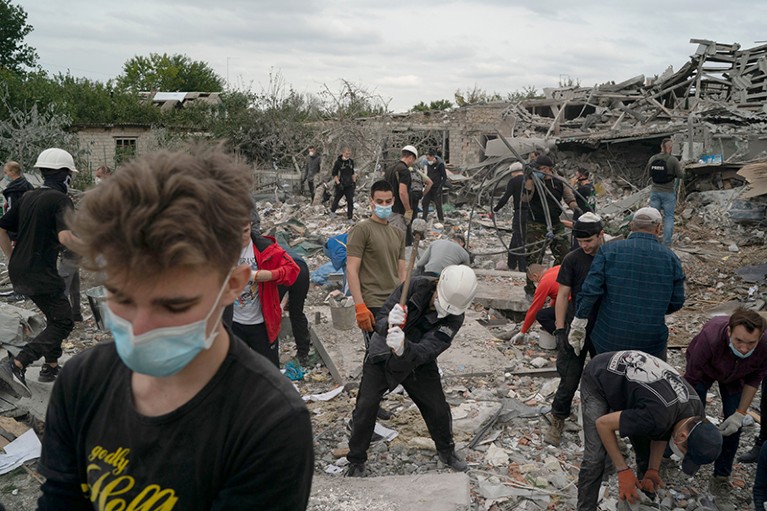 People remove debris of several houses, destroyed after a Russian attack on a residential area in Zaporizhzhia, Ukraine.