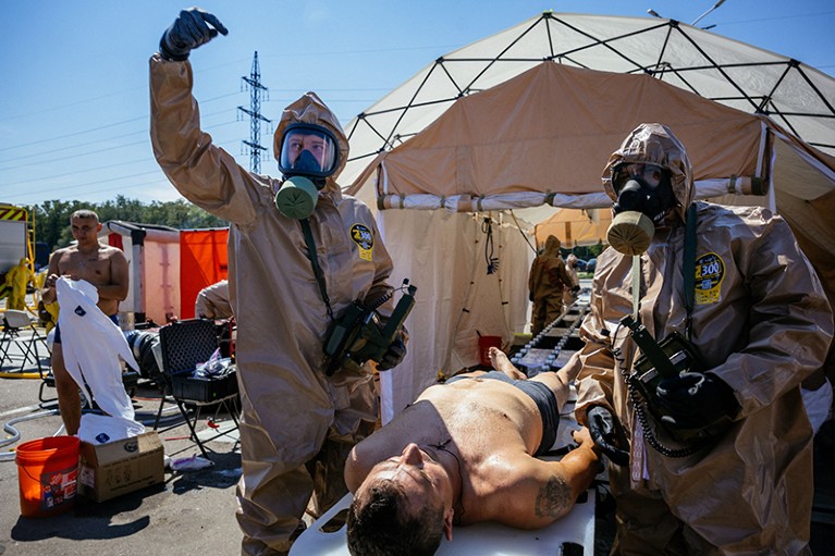 Emergency personnel practise preparedness for a nuclear incident near the Zaporizhzhia nuclear power plant.