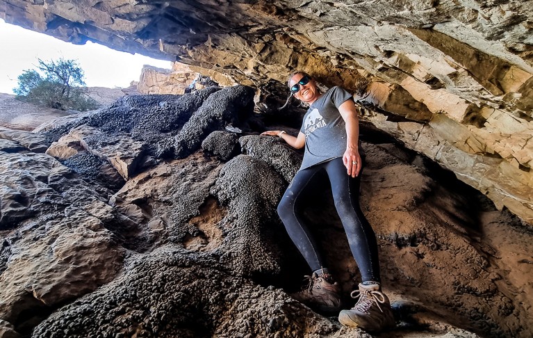 Lynne Quick in a crevasse of a cave during an expedition for research.