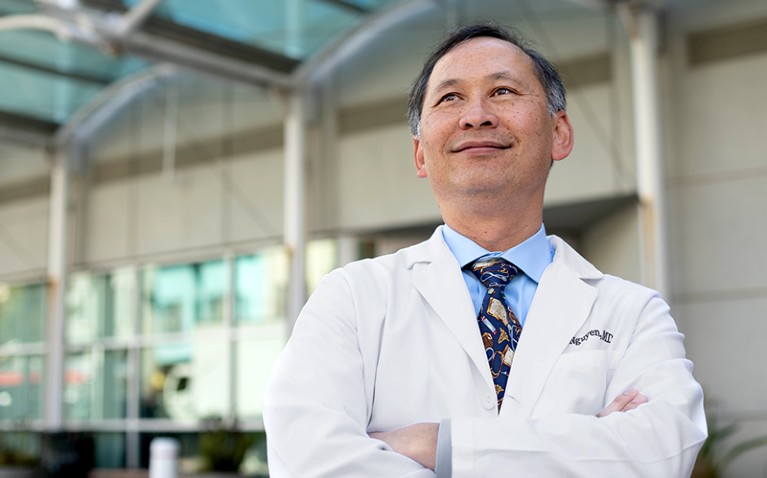 Portrait of Tung Nguyen, wearing a white coat.