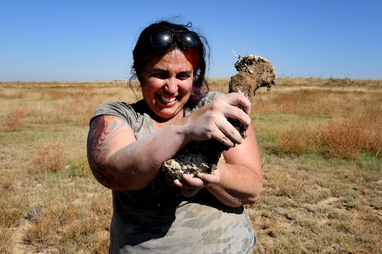 Jackie Billotte holds the hardened plaster mold she made of a female tarantula den near Lamar, Colorado, U.S.