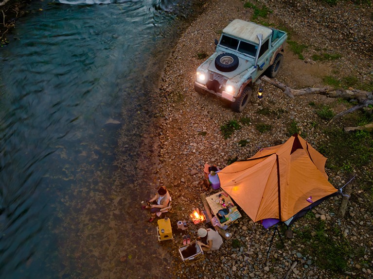 People camping near the river.