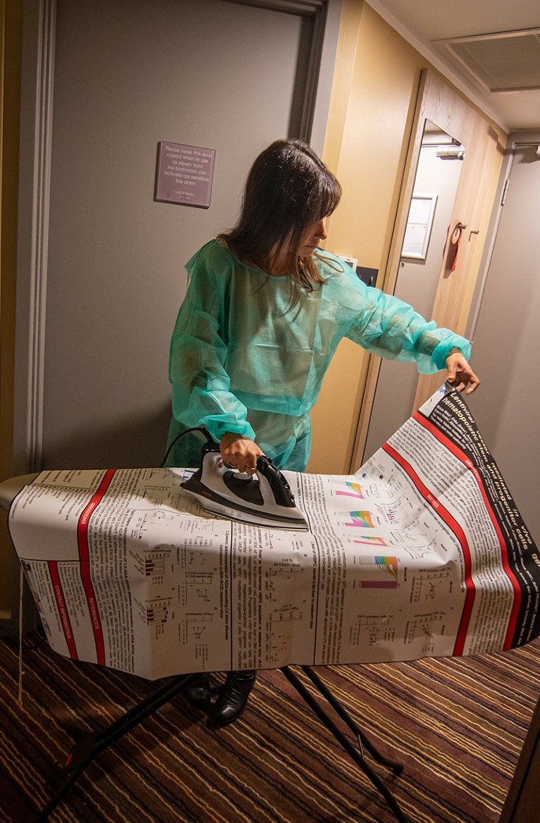 Elena Barbon ironing a poster before a poster session at a scientific conference, Edinburgh, Scotland.