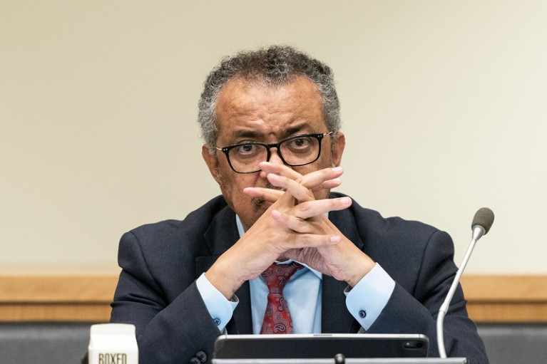 WHO Executive Director Tedros Adhanom Ghebreyesus crosses his hands thoughtfully in front of his face