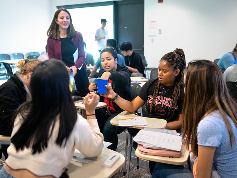 Michelle Smith guides students in an activity that models evolutionary principles.