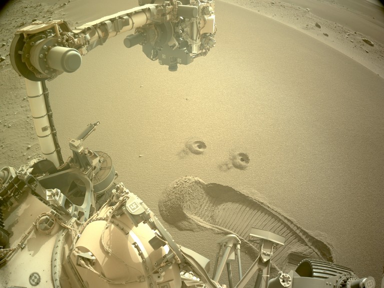 Two holes are in the Martian surface after NASA’s Perseverance rover drilled to collect the mission’s first samples of regolith.