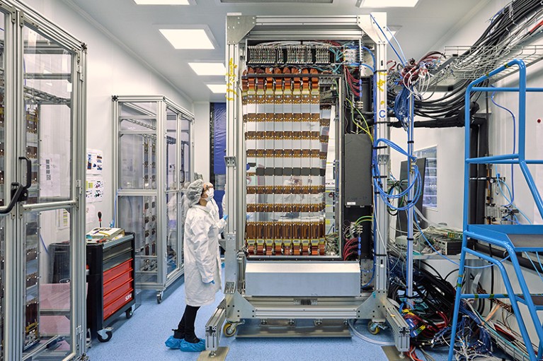 Workers finish assembling the LHCb, Upstream Tracker, detector side C with its silicon staves, electronics and infrastructure.