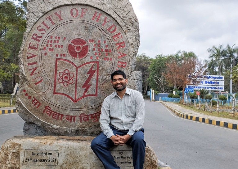 Akash Gautam at the main gate entrance of the University of Hyderabad, in Hyderabad, India.