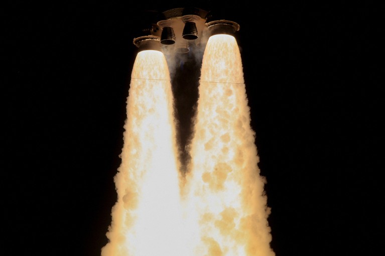 NASA's Space Launch System rocket with the Orion crew capsule lifts off from its launch complex with boosters ignited.