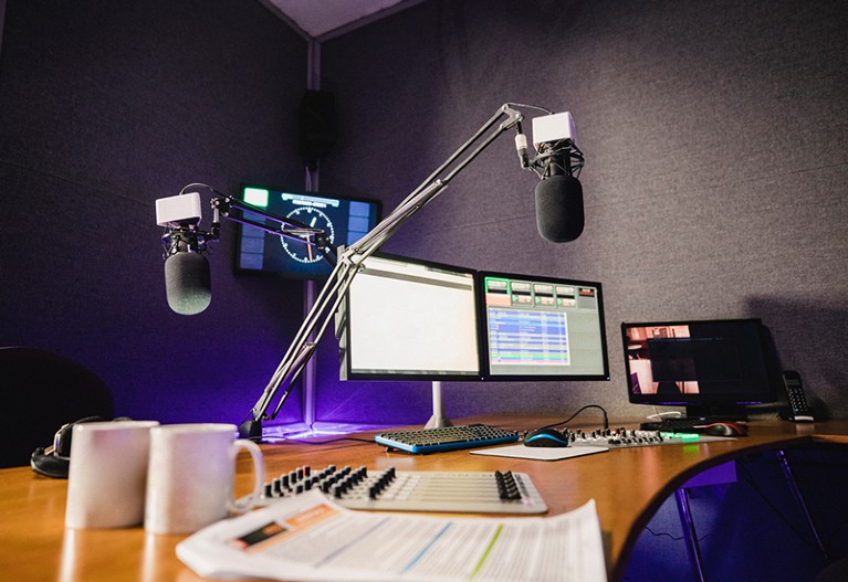 A front view shot of an empty radio station studio interior.