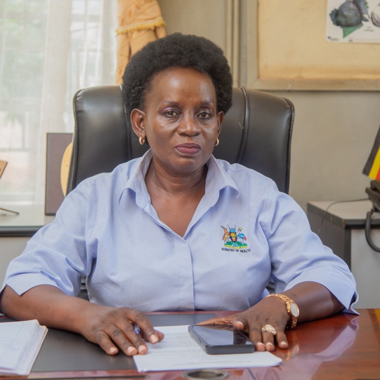 Grace Nambatya Kyeyune at her desk.