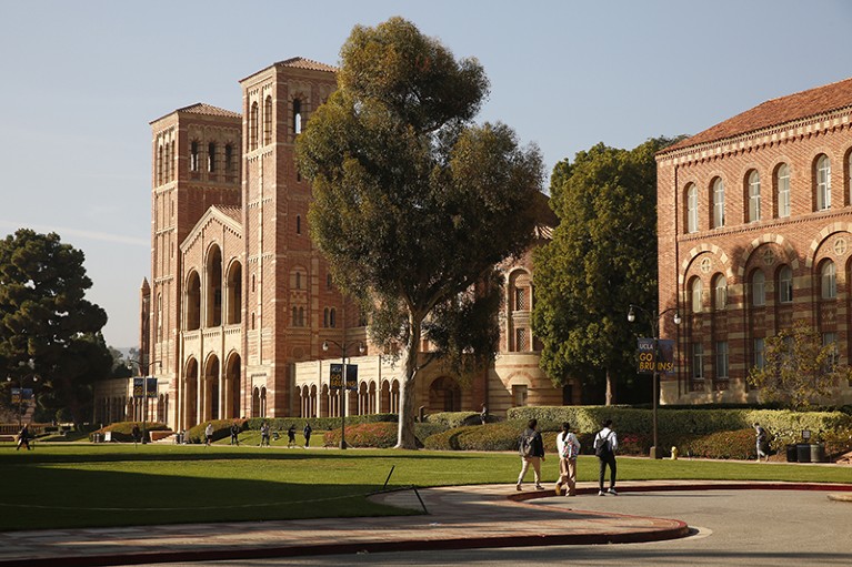 Students walk by Royce Hall on the campus of the University of California, Los Angeles (UCLA) in 2021.