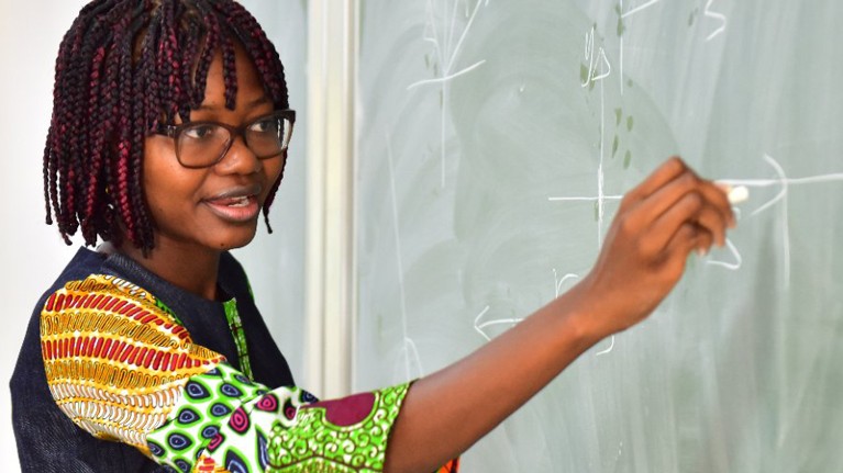 Angela at the blackboard during a lesson on vectors.