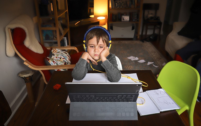 A six-year-old sits in front of his computer as he does homeschooling in Sydney, Australia.