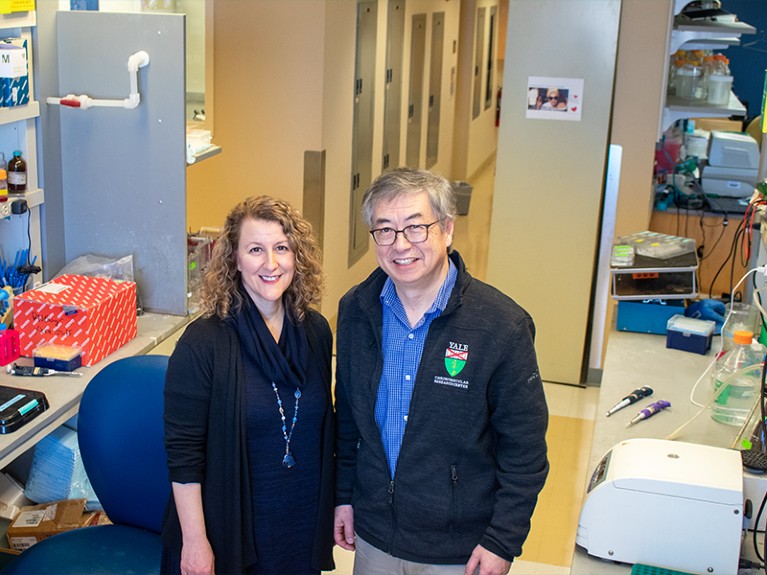 Kathleen Martin and John Hwa working at the Yale Cardiovascular Research Center.