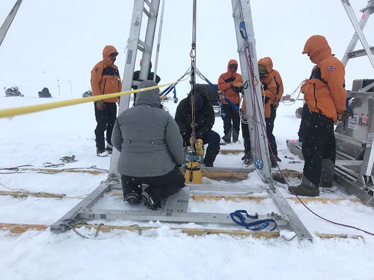 A team with equipment works on the Icefin deployment at Thwaites Glacier in Antarctica, January 2020.
