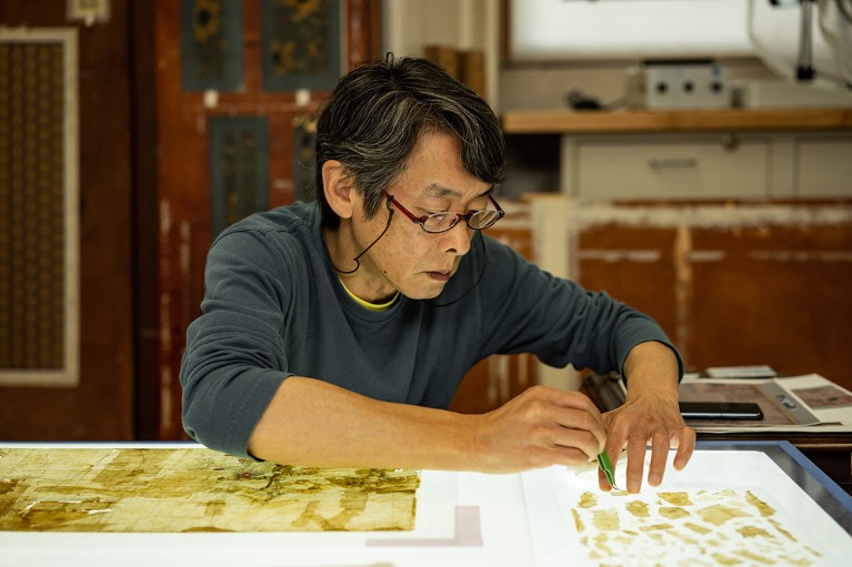 Jiro Ueda’s meticulous process at a lightbox conserving Japanese artworks in the Smithsonian museum’s collection, U.S.