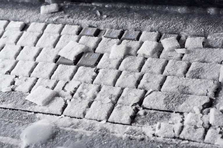 Close-up of ice on a frozen laptop keyboard