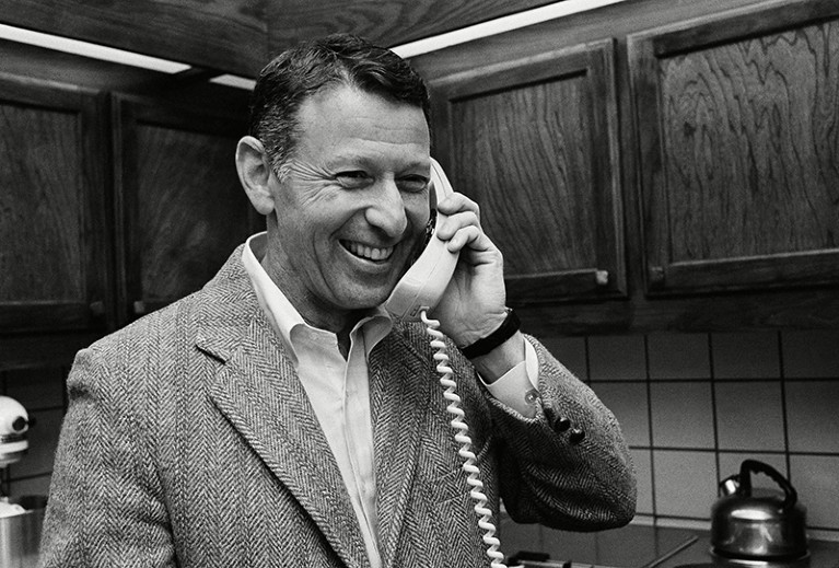 Paul Berg receives a congratulations call after he was named co-winner of the 1980 Nobel Prize for chemistry.