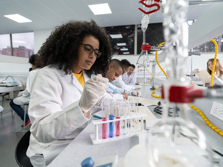 African American woman at a laboratory bench.