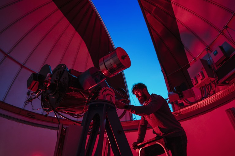 Astronomer in photo telescope dome