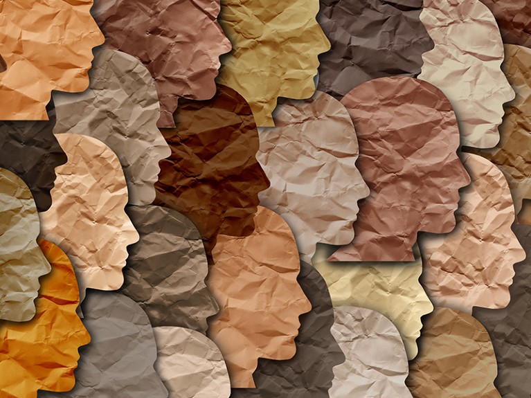 Paper faces pattern of all colors. Black history month celebration of diversity.