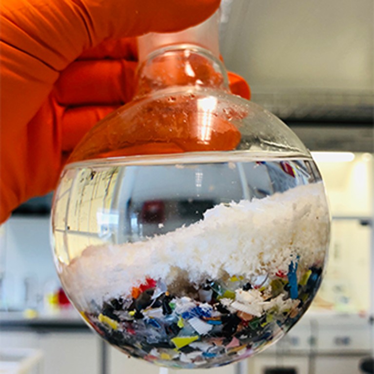 Chemical recycling of PAX polyesters from a mixed plastic waste stream into a flask.