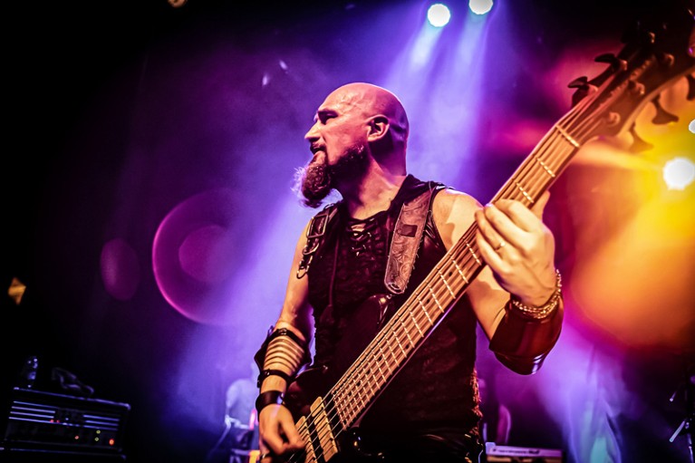 Close-up of Alessandro Sala playing bass for Rhapsody Of Fire